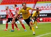 Arsenal's Dani Ceballos, front, celebrates after scoring his side's second goal during the FA Cup sixth round soccer match between Sheffield United and Arsenal at Bramall Lane in Sheffield, England, Sunday, June 28, 2020. (Andrew Boyers/Pool via AP)