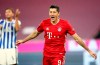 Bayern's Robert Lewandowski celebrates after scoring his side's third goal during the German Bundesliga soccer match between FC Bayern Munich and Hertha BSC Berlin in Munich, Germany, Sunday, Oct. 4, 2020. (AP Photo/Matthias Schrader)