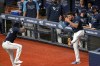 Tampa Bay Rays left fielder Randy Arozarena (56) celebrates with shortstop Willy Adames in front of the dugout after Arozarena hit a three-run home run during the fifth inning of the team's baseball game against the Toronto Blue Jays, Friday, April 23, 2021, in St. Petersburg, Fla. (AP Photo/Phelan M. Ebenhack)