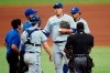 Toronto Blue Jays starting pitcher Hyun Jin Ryu, center, holding ball, reacts after getting hurt during the fourth inning of a baseball game against the Tampa Bay Rays Sunday, April 25, 2021, in St. Petersburg, Fla. Ryu left the game. (AP Photo/Chris O'Meara)