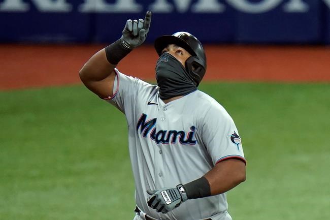 Miami Marlins' Jesus Aguilar celebrates his solo home run off Tampa Bay Rays' Josh Fleming during the fourth inning of a baseball game Friday, Sept. 4, 2020, in St. Petersburg, Fla. (AP Photo/Chris O'Meara)
