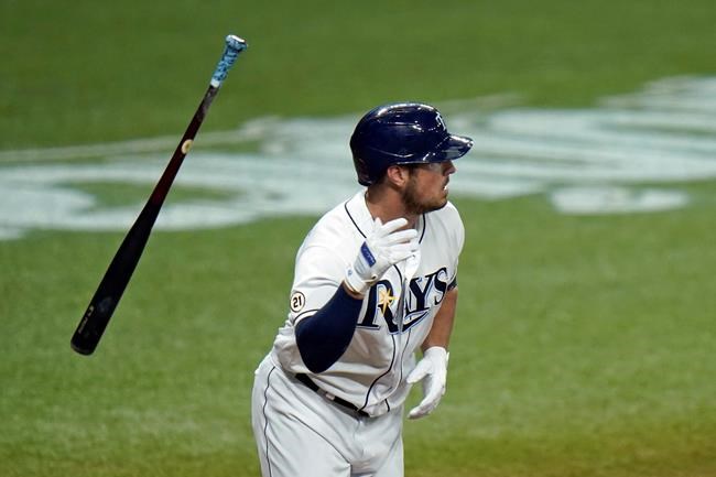 Tampa Bay Rays' Hunter Renfroe flips his bat as he hits a solo home run off Boston Red Sox pitcher Mike Kickham during the fourth inning of a baseball game Thursday, Sept. 10, 2020, in St. Petersburg, Fla. (AP Photo/Chris O'Meara)