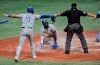 Texas Rangers' Adolis Garcia, center, looks up to see Joey Gallo (13) and home plate umpire Sam Holbrook, right, signal 