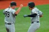 New York Yankees' Gio Urshela, right, celebrates his two-run home run off Tampa Bay Rays starting pitcher Michael Wacha with third base coach Phil Nevin during the third inning of a baseball game Sunday, April 11, 2021, in St. Petersburg, Fla. (AP Photo/Chris O'Meara)