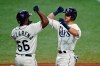 Tampa Bay Rays' Mike Brosseau, celebrates his two-run home run off Toronto Blue Jays starting pitcher Robbie Ray with Randy Arozarena during the sixth inning of a baseball game Saturday, April 24, 2021, in St. Petersburg, Fla. (AP Photo/Chris O'Meara)