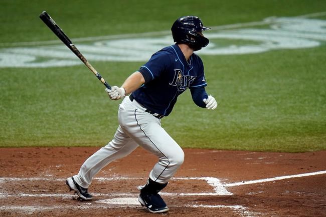 Tampa Bay Rays' Austin Meadows connects for a two-run double off Boston Red Sox pitcher Matt Hall during the fourth inning of a baseball game Friday, Sept. 11, 2020, in St. Petersburg, Fla. (AP Photo/Chris O'Meara)