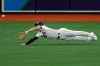 Tampa Bay Rays left fielder Brandon Lowe can't come up with the catch on single by Toronto Blue Jays' Lourdes Gurriel Jr. during the sixth inning of a baseball game Saturday, July 25, 2020, in St. Petersburg, Fla. (AP Photo/Chris O'Meara)