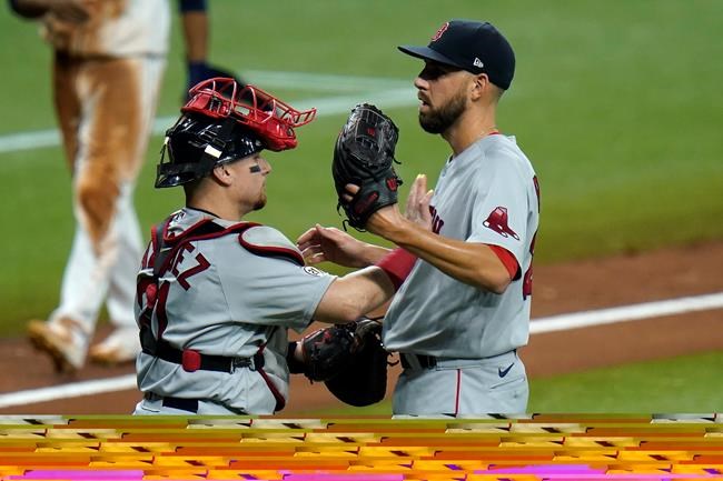 Boston Red Sox catcher Christian Vazquez, left, and pitcher Matt Barnes celebrate after clsoing out the Tampa Bay Rays during the ninth inning of a baseball game Thursday, Sept. 10, 2020, in St. Petersburg, Fla. (AP Photo/Chris O'Meara)