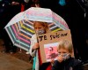 A child holds up a a poster of Samuel Paty as people gather on Republique square in Lille, northern France, Sunday Oct. 18, 2020. Demonstrators in France on Sunday took part in gatherings in support of freedom of speech and in tribute to a history teacher who was beheaded near Paris after discussing caricatures of Islam’s Prophet Muhammad with his class. (AP Photo/Michel Spingler)