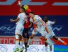 Lens' Loic Bade, left, and Manuel Perez, center, fight for the ball during their French League One soccer match between Lille and Lens in Villeneuve d'Ascq, northern France, Sunday Oct. 18, 2020. (AP Photo/Michel Spingler)