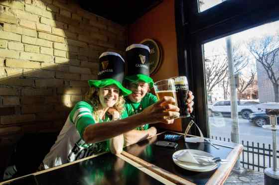 MIKE SUDOMA / WINNIPEG FREE PRESS Di and Jim McDougal hoist some pints as they celebrate St. Patrick's Day at the King's Head on Wednesday evening.
