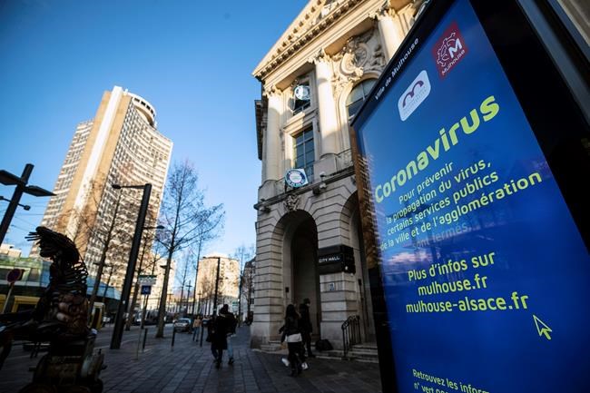 A general view of signs about coronavirus in the city of Mulhouse, eastern France, Monday March 9, 2020. The French government announced last Friday reinforced measures to slow down the spreading of the coronavirus in the two most affected regions, north of Paris and at the German border. In the cluster of the Haut-Rhin region in eastern France, authorities issued a ban on all gatherings except those
