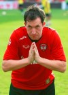 FILE - In this July 10, 2011, file photo, former England national team and Liverpool striker Robbie Fowler greets fans at Muangthong United soccer club on the outskirts of Bangkok, Thailand. Fowler has made more headlines and waves since his arrival for the 2020-21season as a coach in the Indian Super League (ISL) than his more experienced counterparts on the subcontinent. (AP Photo/Apichart Weerawong, FILE)