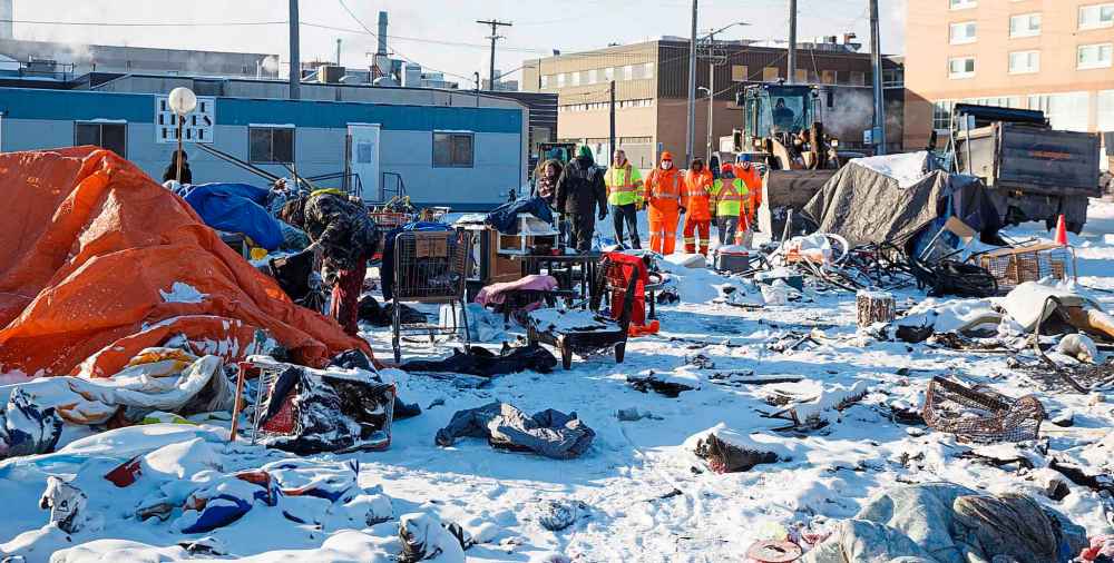 MIKE DEAL / WINNIPEG FREE PRESS
City crews wait to start cleaning up the site of a homeless encampment Thursday morning. The people living in the camps have have been asked to move by the City of Winnipeg for safety reasons.
