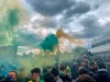 Manchester United fans hold flares as they protest outside of Old Trafford, during a protest against the Glazer family, owners of Manchester United, before their Premier League match against Liverpool at Old Trafford, Manchester, England, Sunday, May 2, 2021. Manchester United supporters have stormed into the stadium and onto the pitch ahead of Sunday's game against Liverpool as fans gathered outside Old Trafford to protest against the ownership. (AP Photo/Rob Harris)