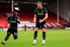 Tottenham Hotspur's Harry Kane, right, celebrates after scoring his side's second goal during the English Premier League soccer match between Sheffield United and Tottenham Hotspur at the Bramall Lane stadium in Sheffield, England, Sunday, Jan.17, 2021. (Stu Forster/Pool via AP)