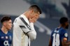 FILE - In this Tuesday, March 9, 2021 file photo Juventus' Cristiano Ronaldo reacts during the Champions League, round of 16, second leg, soccer match between Juventus and Porto in Turin, Italy. Neither Lionel Messi nor Cristiano Ronaldo will be in the Champions League quarterfinals for the first time since 2005. The two greatest players of the current generation were both eliminated from the competition this week. Messi scored a goal but missed a penalty as Barcelona was eliminated by Paris Saint-Germain. Ronaldo and his Juventus teammates were ousted by Porto the night before. Ronaldo has won five Champions League titles in his career. Messi has won four. (AP Photo/Luca Bruno, File)