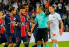 Referee Jerome Brisard waves away the appeals of PSG players for a penalty during the French League One soccer match between Paris Saint-Germain and Marseille at the Parc des Princes in Paris, France, Sunday, Sept.13, 2020. (AP Photo/Michel Euler)