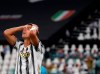FILE - In this Friday, Aug. 7, 2020 file photo Juventus' Cristiano Ronaldo reacts during the Champions League round of 16 second leg, soccer match between Juventus and Lyon at the Allianz stadium in Turin, Italy. The Portuguese soccer federation says Cristiano Ronaldo has tested positive for the coronavirus. The federation says Ronaldo is doing well and has no symptoms. He has been dropped from the country's Nations League match against Sweden on Wednesday. (AP Photo/Antonio Calanni, File)