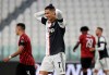 Juventus' Cristiano Ronaldo grimaces during an Italian Cup second leg soccer match between Juventus and AC Milan at the Allianz stadium, in Turin, Italy, Friday, June 12, 2020. The match was being played without spectators because of the coronavirus lockdown. (AP Photo/Luca Bruno)