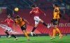 Manchester United's Edinson Cavani tries to score with a header during the English Premier League soccer match between Manchester Utd and Wolverhampton Wanderers at Old Trafford stadium in Manchester, England, Tuesday,Dec. 29, 2020. (Laurence Griffiths, Pool via AP)