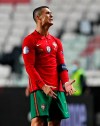 Portugal's Cristiano Ronaldo reacts during the UEFA Nations League soccer match between Portugal and France at the Luz stadium in Lisbon, Saturday, Nov. 14, 2020. (AP Photo/Armando Franca)