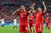 Bayern's Leon Goretzka, left, celebrates after scoring his side's opening goal during the UEFA Super Cup soccer match between Bayern Munich and Sevilla at the Puskas Arena in Budapest, Hungary, Thursday, Sept. 24, 2020. (Bernadett Szabo/Pool via AP)