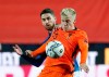 Italy's Jorginho, rear, challenges Netherlands' Donny Van De Beek during the UEFA Nations League soccer match between Italy and the Netherlands at Azzurri d'Italia stadium in Bergamo, Italy, Wednesday, Oct. 14, 2020. (AP Photo/Antonio Calanni)