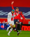 PSG's Kylian Mbappe tries to get in a shot during the French League One soccer match between Lille and Paris Saint-Germain at the Stade Pierre Mauroy stadium in Villeneuve d'Ascq, northern France Sunday, Dec. 20, 2020. (AP Photo/Michel Spingler)