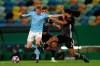 Manchester City's Kevin De Bruyne, left, is challenged by Lyon's Jason Denayer during the Champions League quarterfinal soccer match between Lyon and Manchester City at the Jose Alvalade stadium in Lisbon, Portugal, Saturday, Aug. 15, 2020. (Miguel A. Lopes/Pool via AP)