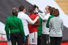Manchester United's Eric Bailly receives treatment after a clash of heads during the English FA Cup semifinal soccer match between Chelsea and Manchester United at Wembley Stadium in London, England, Sunday, July 19, 2020. (Andy Rain, Pool via AP)