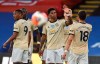 Manchester United's Marcus Rashford, center, celebrates after scoring the opening goal during the English Premier League soccer match between Crystal Palace and Manchester United at Selhurst Park in London, England, Thursday, July 16, 2020. (AP Photo/Glyn Kirk, Pool)