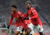 Manchester United's Marcus Rashford, left, celebrates with Paul Pogba after scoring the opening goal during the English Premier League soccer match between Manchester Utd and Wolverhampton Wanderers at Old Trafford stadium in Manchester, England, Tuesday,Dec. 29, 2020. (Michael Regan, Pool via AP)