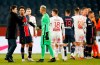 PSG's head coach Mauricio Pochettino, left, greets PSG's Marquinhos and PSG's goalkeeper Keylor Navas after the French League One soccer match between Paris Saint-Germain and Brest at the Parc des Princes in Paris, Saturday, Jan. 9, 2021. PSG won the match 3-0. (AP Photo/Francois Mori)