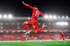Liverpool's Alex Oxlade-Chamberlain celebrates scoring his side's fifth goal during the English Premier League soccer match between Liverpool and Chelsea at Anfield stadium in Liverpool, England, Wednesday, July 22, 2020. (Laurence Griffiths, Pool via AP)
