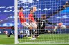 Manchester United's goalkeeper David de Gea fails to stop the third goal during the English FA Cup semifinal soccer match between Chelsea and Manchester United at Wembley Stadium in London, England, Sunday, July 19, 2020. (Andy Rain, Pool via AP)