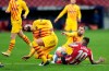 Barcelona's Gerard Pique, left, reacts after getting an injury in a challenge with Atletico Madrid's Angel Correa during the Spanish La Liga soccer match between Atletico Madrid and FC Barcelona at the Wanda Metropolitano stadium in Madrid, Spain, Saturday, Nov. 21, 2020. (AP Photo/Bernat Armangue)