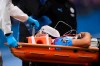 Manchester City's Eric Garcia leaves the field injured during the English Premier League soccer match between Manchester City and Arsenal at the Etihad Stadium in Manchester, England, Wednesday, June 17, 2020. The English Premier League resumes Wednesday after its three-month suspension because of the coronavirus outbreak. (Laurence Griffiths/Pool via AP)