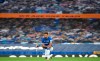 Everton's Mason Holgate takes a knee before the English Premier League soccer match between Everton and Liverpool at Goodison Park in Liverpool, England, Sunday, June 21, 2020. (/Pool via AP)