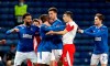 Rangers Glen Kamara, center, is held back by teammates as he reacts near the end of the Europa League Round of Sixteen soccer match between Rangers and Slavia Prague, at Ibrox Stadium, in Glasgow, Scotland, Thursday March 18, 2021. (Andrew Milligan/PA via AP)