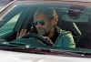 Liverpool soccer team manager Jurgen Klopp waves as he arrives at the club's Melwood training ground after the English Premier League announced players can return to training in small groups as the coronavirus lockdown is eased Wednesday May 20, 2020. (Peter Byrne/PA via AP)