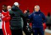 Liverpool manager Jurgen Klopp, left, interacts with Tottenham Hotspur manager Jose Mourinho after their English Premier League soccer match between Liverpool and Tottenham Hotspur at Anfield in Liverpool, England, Wednesday, Dec., 16, 2020. (Clive Brunskill/ Pool via AP)