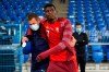 Switzerland's Breel Embolo walks off the pitch with a medical staff member after being injured during the UEFA Nations League soccer match between Switzerland and Germany at the St. Jakob-Park stadium in Basel, Switzerland, on Sunday, Sept. 6, 2020. (Peter Klaunzer/Keystone via AP)