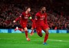 Liverpool's Georginio Wijnaldum celebrates after scoring his side's opening goal during a second leg, round of 16, Champions League soccer match between Liverpool and Atletico Madrid at Anfield stadium in Liverpool, England, Wednesday, March 11, 2020. (Peter Byrne/PA via AP)