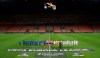 Inter Milan, left, and Ludogorets line-up inside the empty San Siro stadium in Milan, Italy ahead of their Europa League round of 32 second leg soccer match Thursday Feb. 27, 2020. Inter beat Ludogorets 2-1 in an empty stadium as a precaution because of the virus outbreak in Italy. (Emilio Andreoli, UEFA via AP )