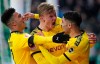 Dortmund's Erling Haaland, center, celebrates scoring a goal against Werder Bremen during the German Bundesliga soccer match in Bremen, Germany, Saturday Feb. 22, 2020. (Peter Steffen/DPA via AP)