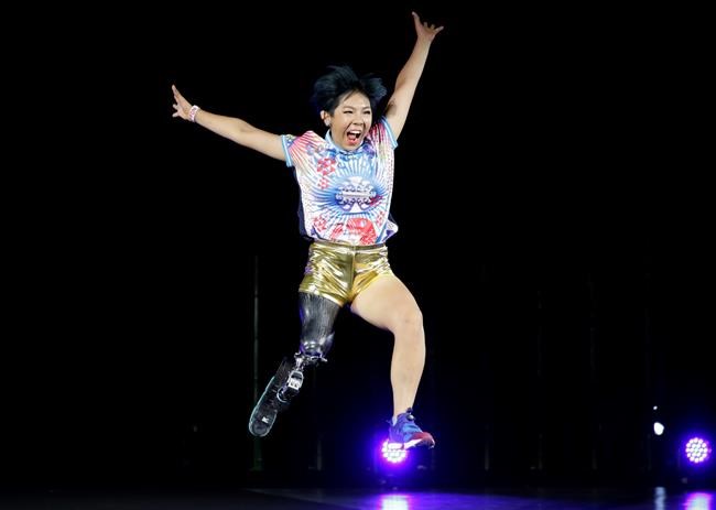 Kaede Maegawa, a Paralympian, participates in a fashion show dubbed