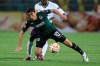 FILE - In this Oct. 2, 2014, file photo, Krasnodar's Odil Ahmedov, front, fights for the ball with Everton's Christian Atsu during the Europa League Group H soccer match between Krasnodar and Everton in Krasnodar, Russia. In a bid to complete the 2020 season in the midst of restrictions caused by the COVID-19 pandemic, the Chinese Football Association decided to split the 16 top-tier CSL teams into two groups based in the hub cities of Dalian and Suzhou. (AP Photo/Vitaly Timkiv, File)