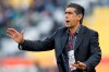 FILE - In this Jan. 15, 2011, file photo, Iran's team coach Afshin Ghotbi reacts against North Korea during their AFC Asian Cup group D soccer match in Doha, Qatar. An eight-month wait for the new Chinese Super League to start is nearly over, a delay nearly as long as it takes to play a regular season. And July 25 can't come soon enough for the players and coaches. (AP Photo/Hassan Ammar, File)