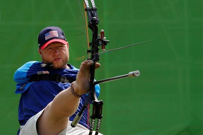 FILE -In this Sept. 14, 2016, file photo, Matt Stutzman, of United States, holds the bow with his foot as he competes in the individual compound-open, during the Paralympic Games at the Sambadrome, in Rio de Janeiro, Brazil. Stutzman is among several Paralympic athletes who are profiled in the Nexflix documentary “Rising Phoenix” that will be released in 190 countries on Wednesday, Aug. 26, 2020.(AP Photo/Silvia Izquierdo, File)